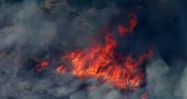 Wildfires scorch the West as a heat wave threatens Midwest and Northeast