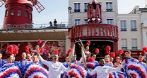 Olympic torch relay helped through Paris by cancan dancers and K-pop star