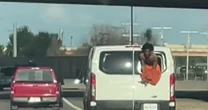 Oklahoma inmate seen hanging out of transport van