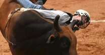 Professional bull rider gored in throat by bull horn during rodeo