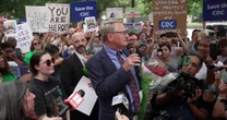Protesters Rally at CDC: 'Let's Get the Politics Out of Public Health'