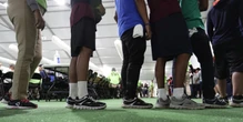 Outreach workers go door to door, looking for separated families