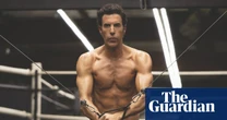 ‘This is not AI’: why oiled-up abs are the least radical thing about Sacha Baron Cohen’s reinvention