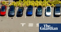 Tesla reports steep drop in profits despite US rush to buy electric vehicles