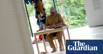 Artist punches holes in UN climate report six hours a day for Dutch installation