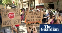 Barcelona residents rally against mass tourism – video