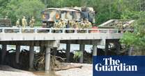 Towns cut off by Queensland floods warned against panic-buying as premier vows ‘resilient’ rebuild