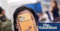 Apple hits $4tn market value as new iPhone models revitalize sales