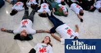 Fired USAid workers and HIV activists hold ‘die-in’ to protest Trump and Musk