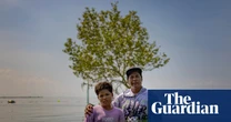 Trees, homes, roads: how the sea is swallowing coastal villages in the Philippines – in pictures