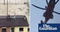 People rescued from rooftops as flooding hits northern Italy – video