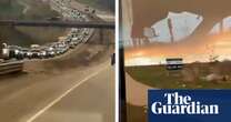 Canada wildfires: huge queues on highway as thousands evacuate oil town – video