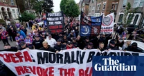 ‘It’s not fair’: Crystal Palace fans march in protest at demotion from Europa League