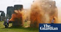 Activists spray Stonehenge with orange powder paint ahead of summer solstice – video