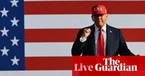 Trump celebrates tax bill passing, UK electric car sales rise – business live