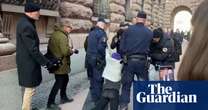 Greta Thunberg dragged by police from climate protest outside Swedish parliament – video