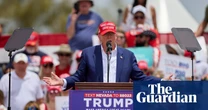 Trump refuses to shift on climate despite supporters needing aid at rallies in extreme US heat