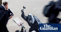 Court staff cover up Banksy image of judge beating a protester