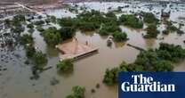 Drone video shows parts of Australia's largest sheep station underwater in WA floods – video