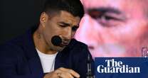 Luis Suárez holds back tears as he announces retirement from international career – video