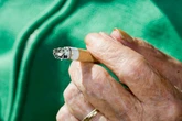 Old lady caught by firefighters throwing cigarettes at fire started by cigarette