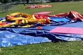 Tot in critical condition as 'sudden' storm lifts bouncy castle 12ft off the ground