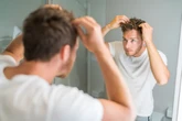 Blokes care more about 'bad hair days' than women – many even avoid the pub