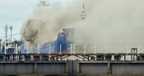 Hull fire: Huge blaze on ship causes thick plume of smoke to engulf city centre