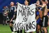 Man Utd star holds 'Falklands belong to us' banner with Argentina team after England exit