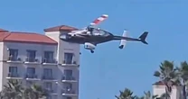 LiveCalifornia helicopter crash: Aircraft plummets from sky as beachgoers watch in horror