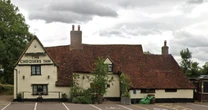Crossbow wielding man dies after stand-off with police over village pub fire