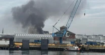 LivePoole fire LIVE: Locals issued warning as dozens of firefighters tackle huge blaze