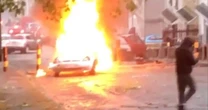 Terrified boy asks 'are we going to die mummy?' as 200 yobs set cars on fire at vigil