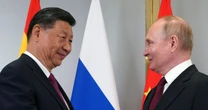 Smiling Putin meets with 'old pal' President Xi in power move against West