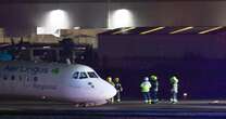 BREAKING: Belfast airport: Plane crash lands as landing gear collapses whilst 82mph winds batter UK