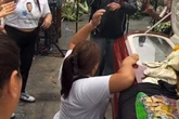 Crying widow twerks and shakes bum on husband’s coffin in bizarre send-off