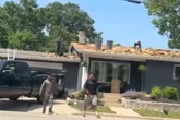 Men fall off roof mid-fight and continue brawl on the ground in viral video