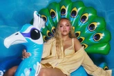 Rihanna strips down to lacy lingerie and straddles inflatable peacock in sultry new shoot