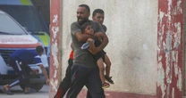 Haunting pictures show parents running with kids as Israel launches Gaza assault