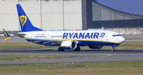 Ryanair flight grounded as passenger 'tries to open emergency exit' in mid-air