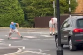 Men in St George flag masks paint on zebra crossing as people say 'it's not English'