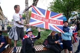 Russia to track all migrants and 'demand DNA' while UK hotel fury grows