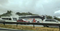 LiveM5 LIVE: Huge traffic delays as dozens evacuated after coach fire