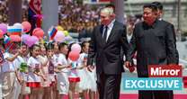 'Coy' Vladimir Putin and Kim Jong-un practically hand-in-hand for 'tactile' meeting