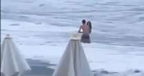 Couple shared final kiss amid crashing waves before girlfriend washed out to sea and presumed dead