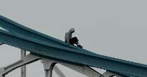 Tower Bridge closed in London as hooded man seen climbing up the railings