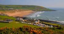 Small UK seaside town with golden sands and late night ice cream parlour