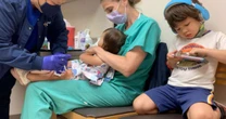 Parents' joy as children aged 1, 3 and 6 among youngest ever to be given Covid jabs