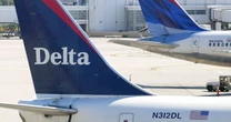 Passengers tackle off-duty attendant filmed 'vowing to bring plane down over intercom'