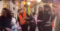 Rowdy man slaps female bouncer and scales taxi in wild city centre rampage